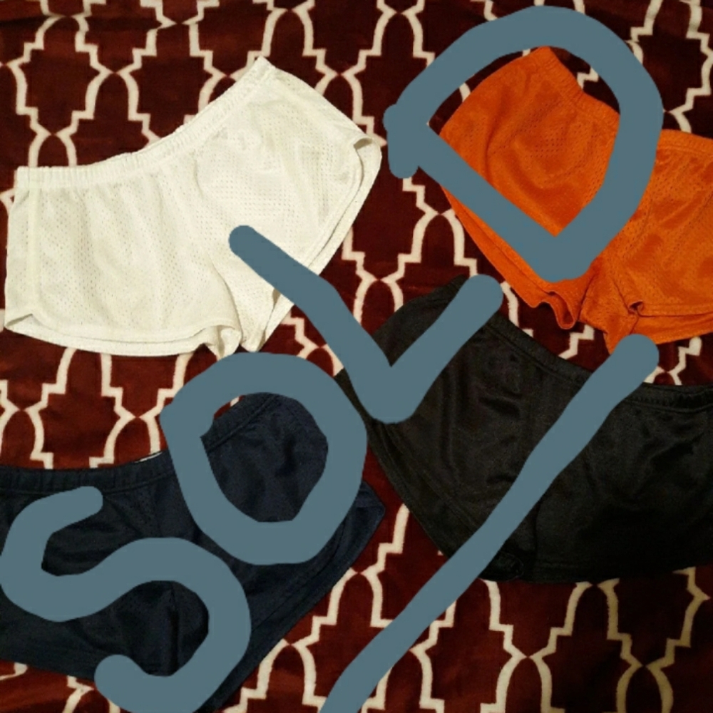 Four pairs of soffe shorts